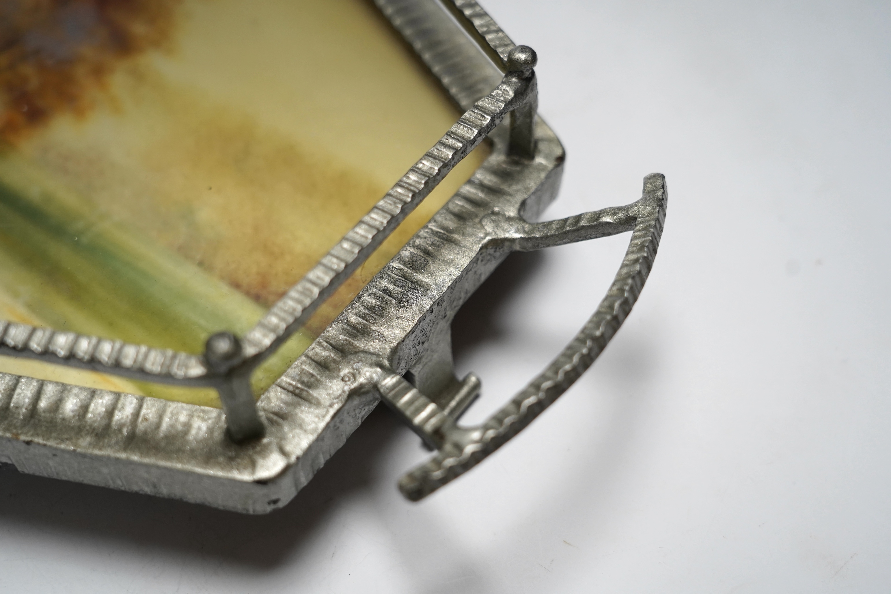 An Art Deco reverse painted and wrought iron tray, with a gallery, centered with a reverse painted landscape scene, signed 'Germonde', 70cm. Condition - damaged